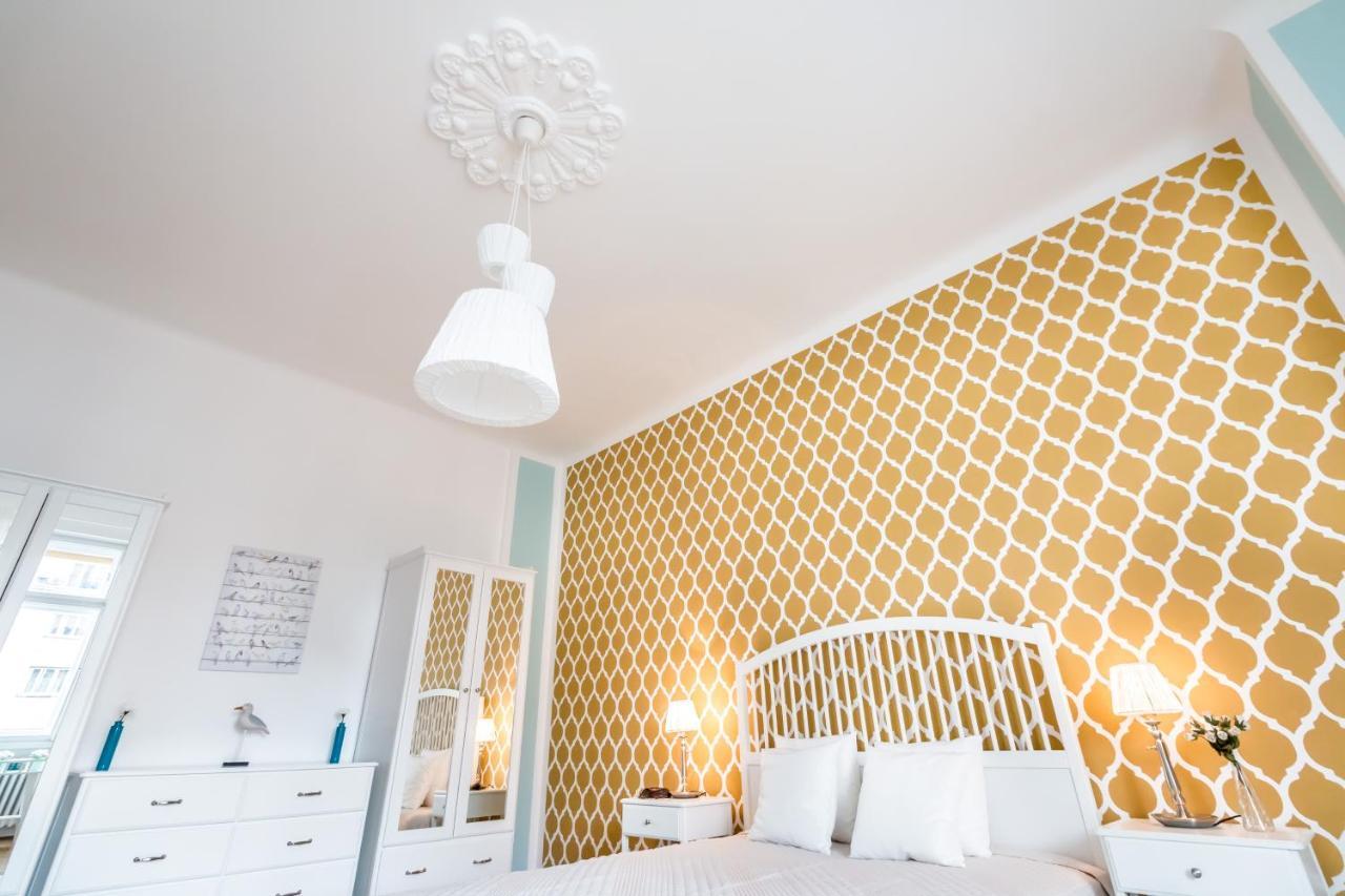 Golden Esthetic With Red Sofa Apartament